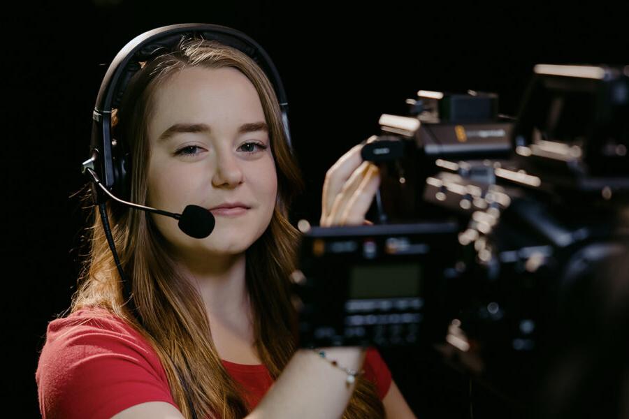 a cinema arts student holding a video camera